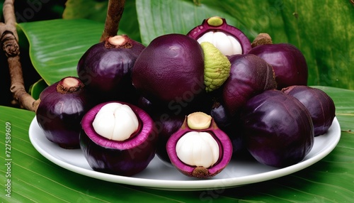 A plate of purple fruit with white centers