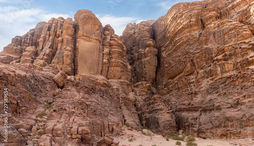 Bizarre shapes of high mountains in red desert of the Wadi Rum near Amman in Jordan