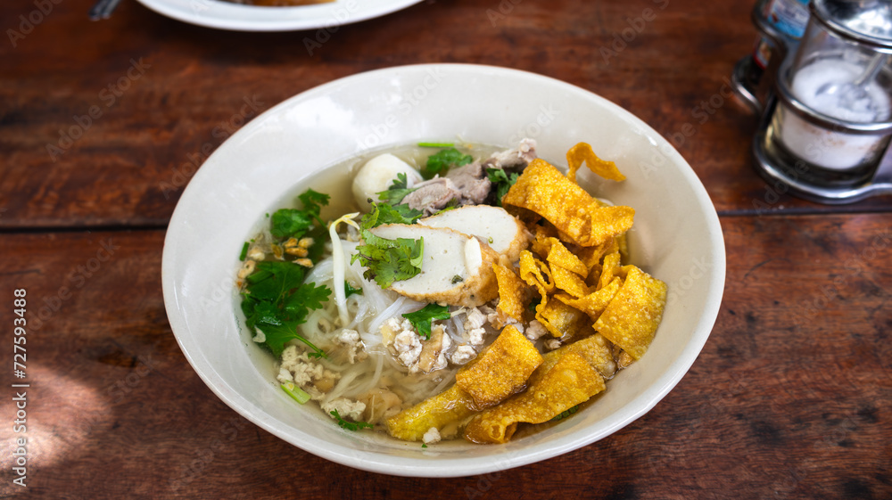 Pork noodles, clear soup, thin noodles ,add fried dumplings and fish balls vegetables, Thai noodle in blow Pork noodles, clear soup, thin noodles ,add fried dumplings and fish balls vegetables, Thai noodle in blow