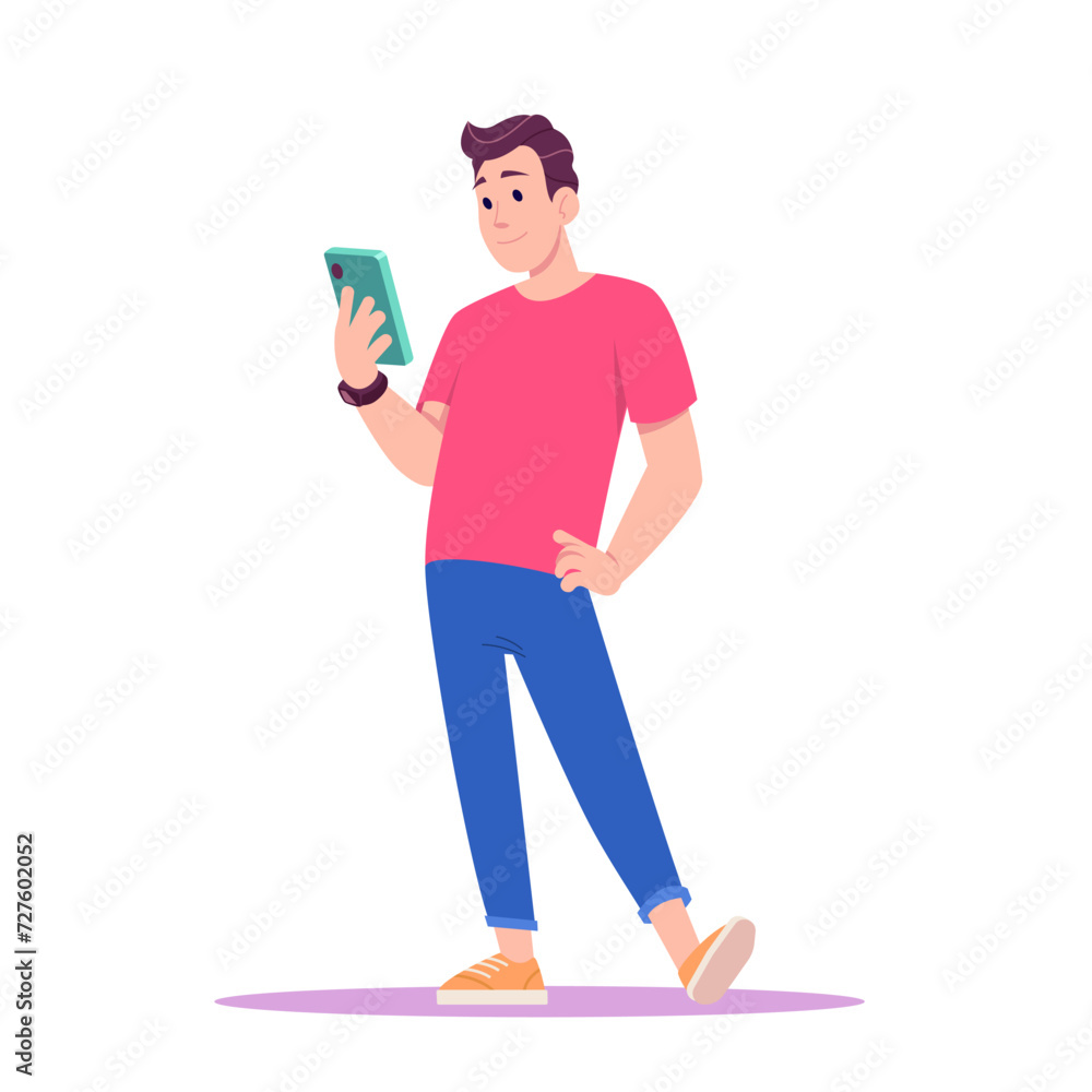Young man in red T-shirt and sneakers standing and looks at his smartphone. Young man in red T-shirt and sneakers standing and looks at his smartphone.