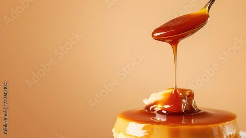 Silky caramel sauce flowing onto a creamy flan on a warm background