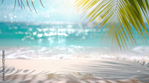 Close-up of sandy beach with palm tree shadows and sea © mariiaplo