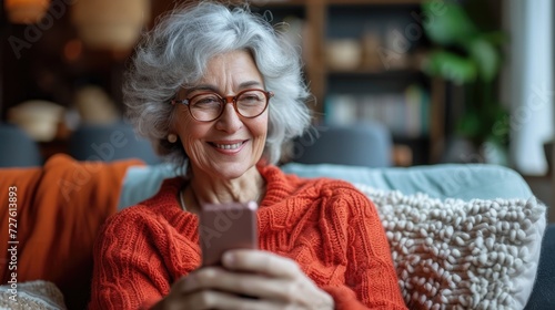 Mature Woman using smartphone sitting on couch with a fee space for text, Generative AI. photo