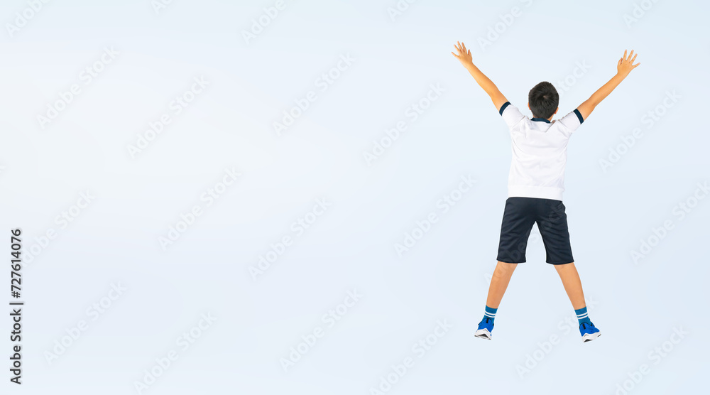 ジャンプする体操服を着た男の子の後ろ姿（切り抜き背景透過PNGも販売しております。作成者リンクから「PNG」で検索してください）
