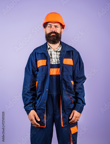 Builder in hardhat. Construction man with helmet. Worker in helmet at building. Portrait of Engineer Builder with Helmet. Worker from building site. Worker manager in helmet.
