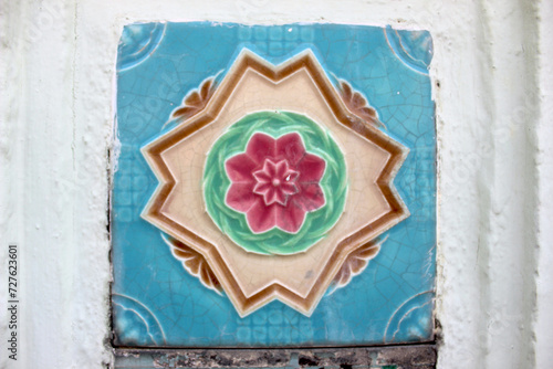 Photography Close Up on Colorful Patterned Peranakan Ceramic Tiles Decorating the Walls of Shophouses at Joo Chiat Heritage District in Singapore