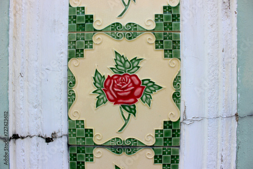 Photography Close Up on Colorful Patterned Peranakan Ceramic Tiles Decorating the Walls of Shophouses at Joo Chiat Heritage District in Singapore