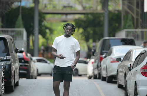 A young man with his hairstyle and the atmosphere of living in the community. © Wosunan