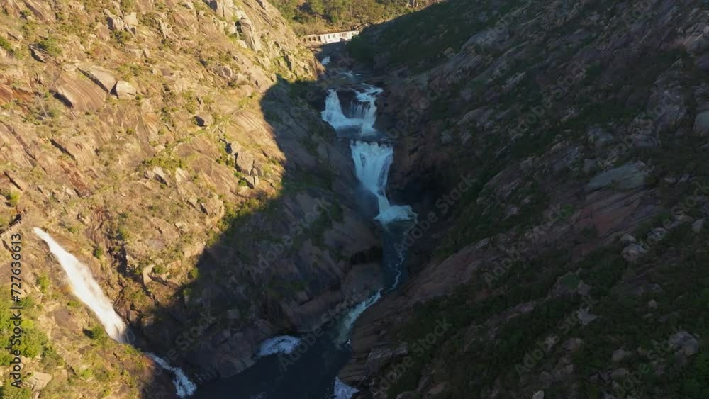 Series Of Waterfalls In Xallas River And Mountain Hills In Summer In A Coruña, Spain. - aerial pullback Series Of Waterfalls In Xallas River And Mountain Hills In Summer In A Coruña, Spain. - aerial pullback