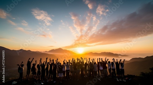 Vibrant mountain sunrise. silhouette of energetic group joyfully jumping in the air