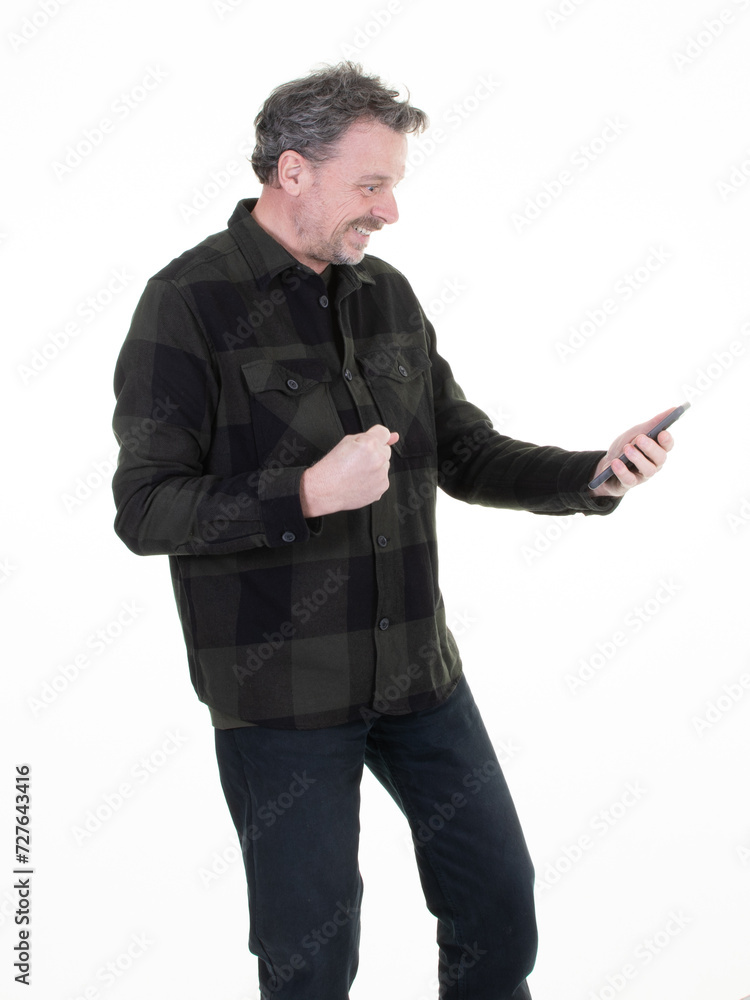happy fun smiling man middle aged hanging looking smartphone on white background happy fun smiling man middle aged hanging looking smartphone on white background