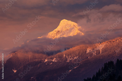 Fototapeta Naklejka Na Ścianę i Meble -  Glowing Mount Cheam at sunset with dramatic sky