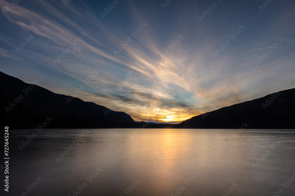 long exposure of sunset at a lake in the mountains