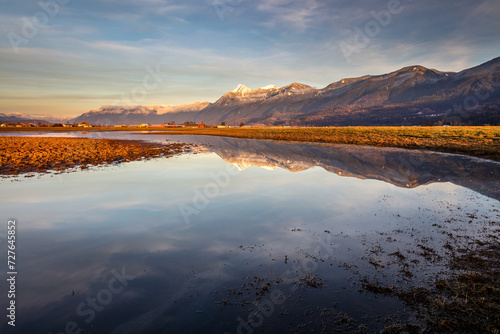 A reflection of Chilliwack's iconic mountain, Mount Cheam in winter with snow at the summit photo