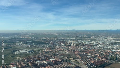 Pollution over Madrid city, in Spain, in a cold winter day with high pressure. Left side view from an airplane cabin. photo