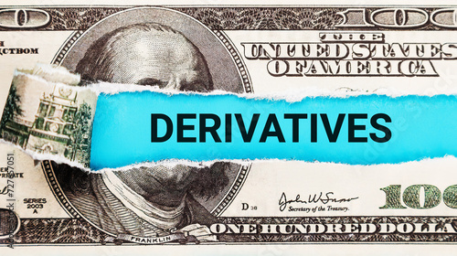 Derivatives. The word Derivatives in the background of the US dollar. Derivatives Market Analysis with Financial Charts. Risk Management, Hedging, and Investment Strategies Concept in Finance. photo
