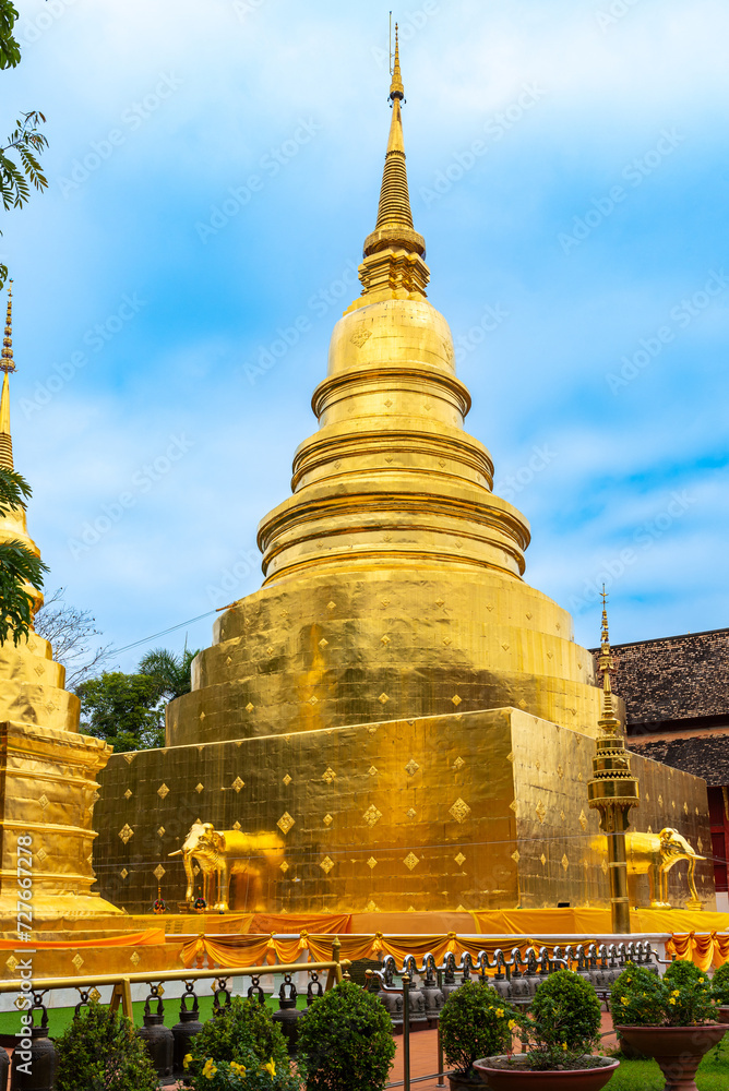 Fototapeta premium Golden Chedi Phrathatluang, built in 1345 and located in the royal temple of the first grade Wat Phra Singh in the old town of Chiang Mai, is the most important temple in the city