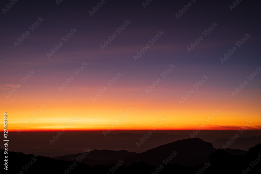 Beautiful skyline in sunrise over mountains.