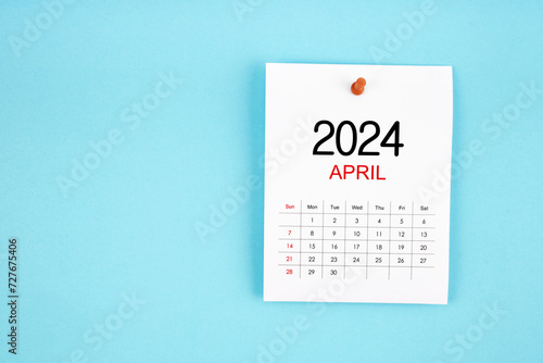 April 2024 calendar page with push pin on blue background.
