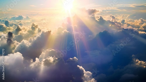 Strong sunshine piercing through the clouds with shining rays illuminating the sky
 photo