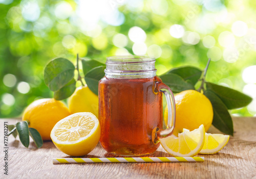 glass jar of lemon iced tea with fresh fruits