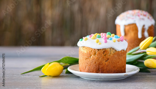 Easter cake, eggs and flowers on a wooden table. Selective focus #727686875
