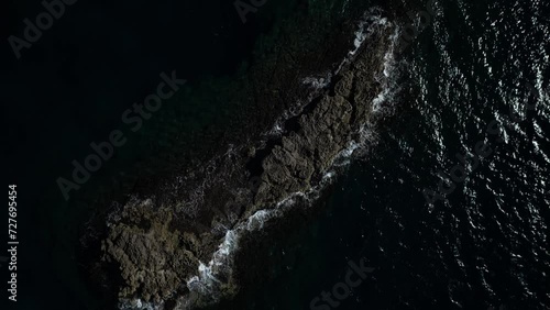 Aerial view of Cala Sapone, S. Antioco bay in Sardinia. Crystal clear sea, moored boat and white sand.