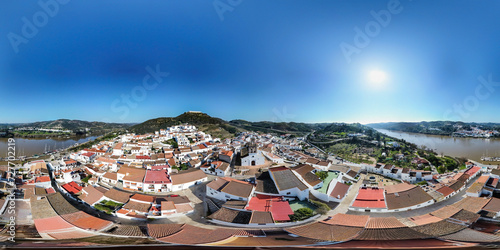 Aerial panoramic view of Sanlucar de Guadiana village in 360 degrees. Spanish town on the banks of Guadiana river in the border of spain with portugal, in front of the portuguese village of Alcoutim