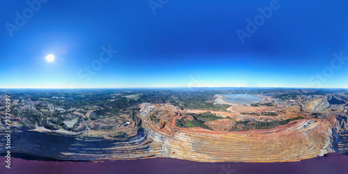 Aerial drone view of Corta Atalaya with mining levels at open mine pit. Deep excavation of pyrite and extraction of minerals of copper and gold in Minas de Riotinto, Huelva, Andalusia, Spain