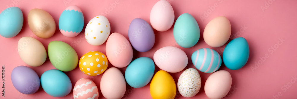 Colorful easter eggs on pastel pink background