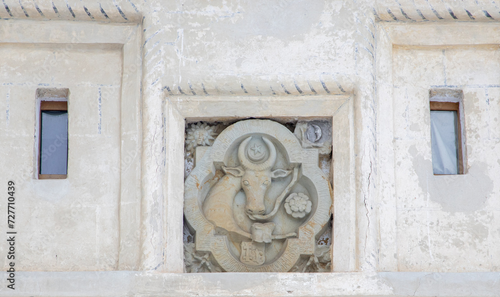 The stone sculpture with an ox head on the wall of the Putna monastery - Romania. In the past it represented the emblem of Moldova