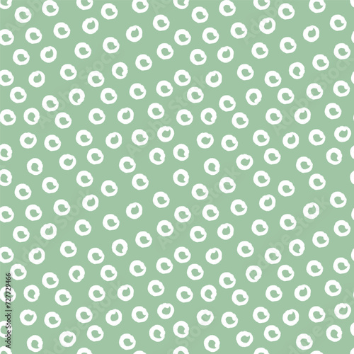 Random circle spots, abstract minimalistic retro background. Seamless vector pattern with rounded stains. Monochrome simple green vector illustration.