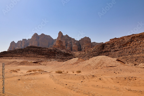 orange sand and rocky mountains on wadi rum desert photo
