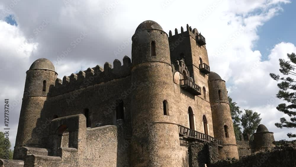 A stone ruins of medieval castle. Historic fortress in Gondar, cultural heritage and famous monument in Ethiopia. Unesco world heritage. Building, old architecture. A stone ruins of medieval castle. Historic fortress in Gondar, cultural heritage and famous monument in Ethiopia. Unesco world heritage. Building, old architecture.