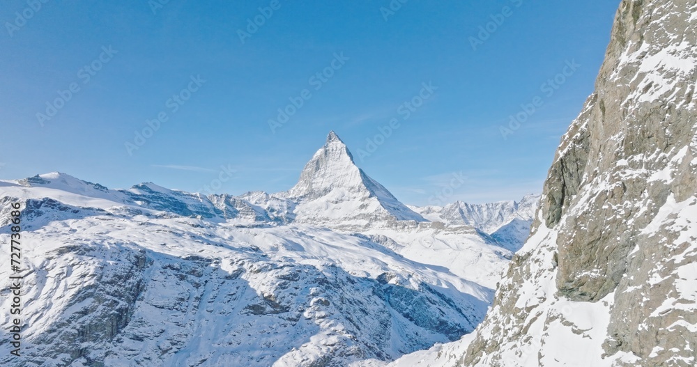 Gornergrat with Matterhorn view during winter in Switzerland. Majestic mountain peaks iconic famous zermatt travel ski resort in the alps. Wonderful inspiring nature landscape.