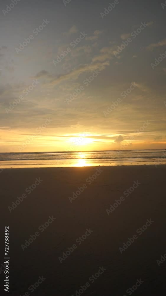 vertical video of beautiful views of the sunset on the beach with small waves, natural panoramas in the afternoon on Cipatujah Tasikmalaya beach vertical video of beautiful views of the sunset on the beach with small waves, natural panoramas in the afternoon on Cipatujah Tasikmalaya beach
