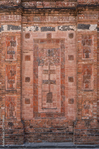 Vertical view of terracotta decor on exterior brick wall of ancient Bagha Shahi mosque, Bagha, Rajshahi, Bangladesh