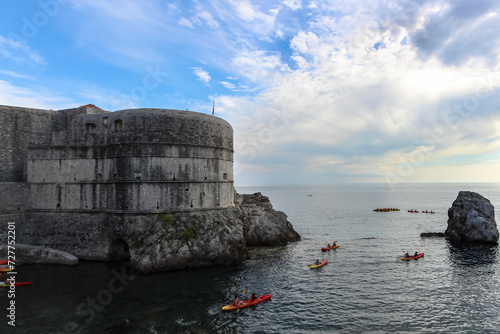 Dubrovnik Dreamscape: White Castle, Seasides, Rocks, Canoes, and the Tranquil of Blue Sky and Rocks.