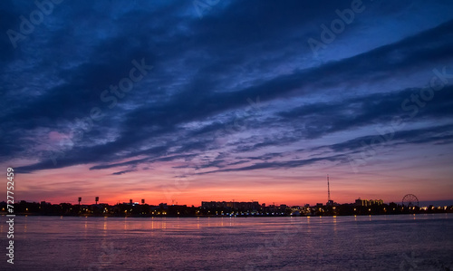 Landscape with sky covered with Stratus clouds and river. Early morning.