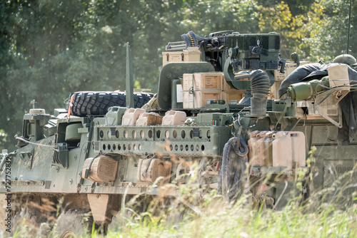heavily laden USA Stryker 8-wheeled fighting vehicle in motion