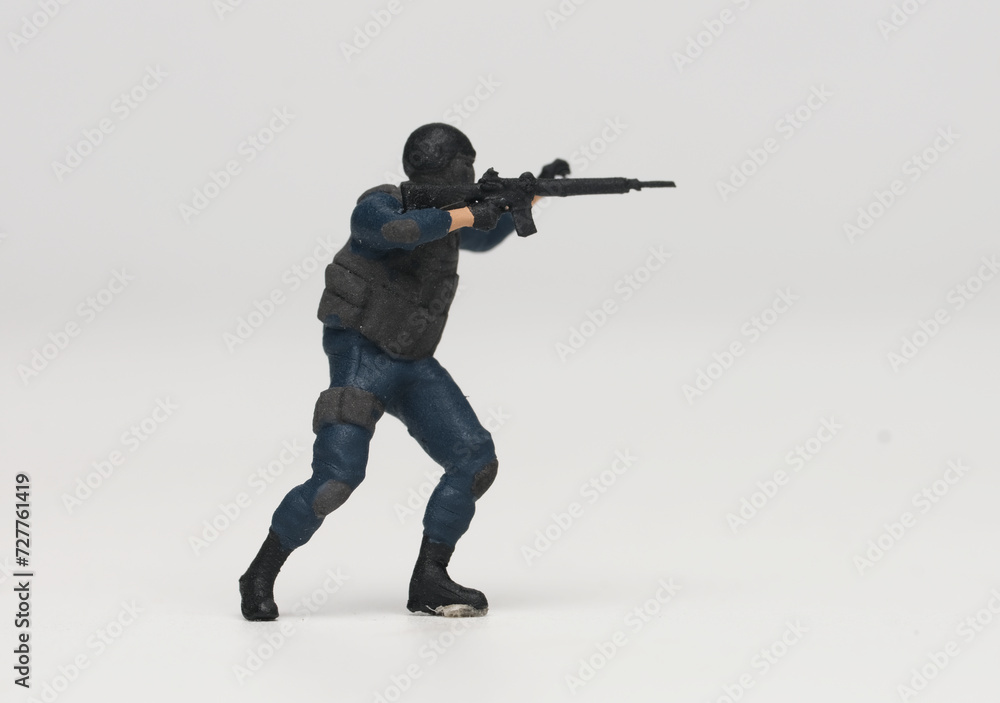 A picture of miniature anti terrorist force on white background. A picture of miniature anti terrorist force on white background.