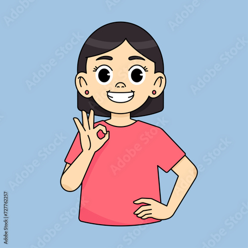 The girl smiles and shows an approving OK gesture and recommends something good