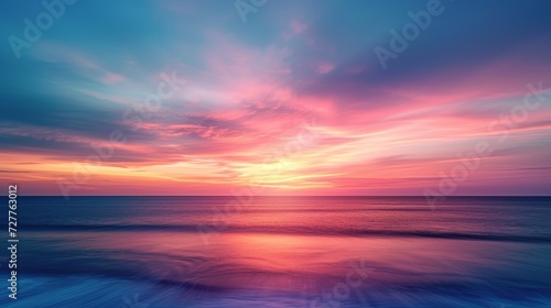 A springtime sunset with a blurred horizon and the hues of delicate clouds captivating the imagination.