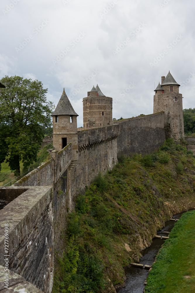 stonework of an aged medieval castle, the Chateau de Fougeres, France