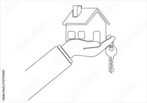 Drawing a continuous line of the house on the hand with the keys. The concept of building housing for young families.