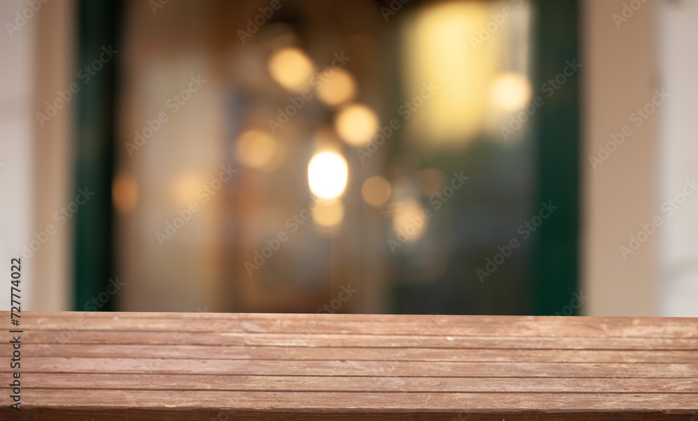 3D rendering, wooden top table with bokeh light effect and blurred cafe restaurant in the background, windows background blur
