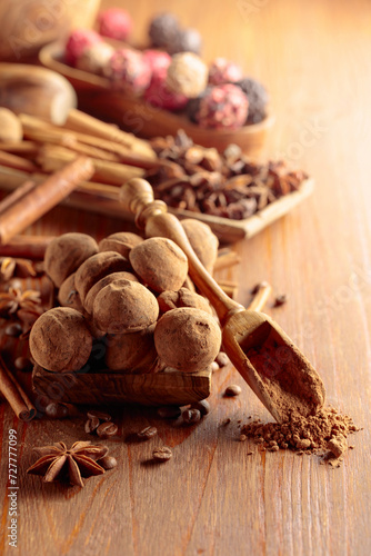 Chocolate truffles on a wooden table. © Igor Normann