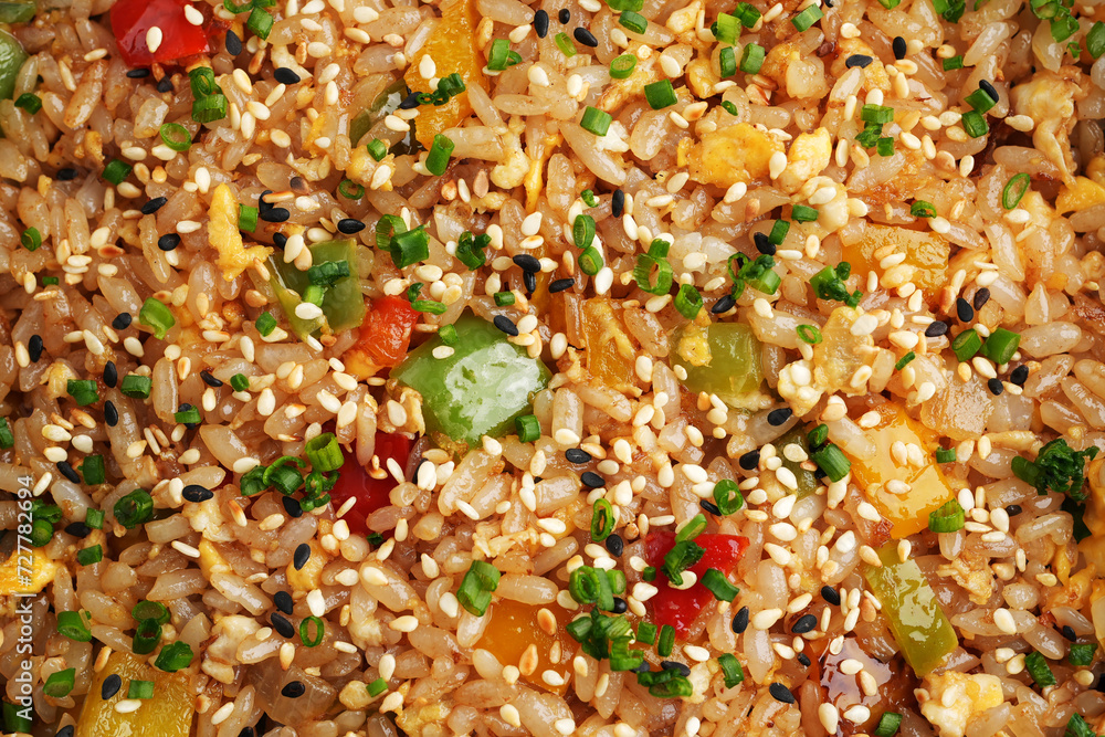 Fried rice with vegetables. Prepared and served in a wok Fried rice with vegetables. Prepared and served in a wok