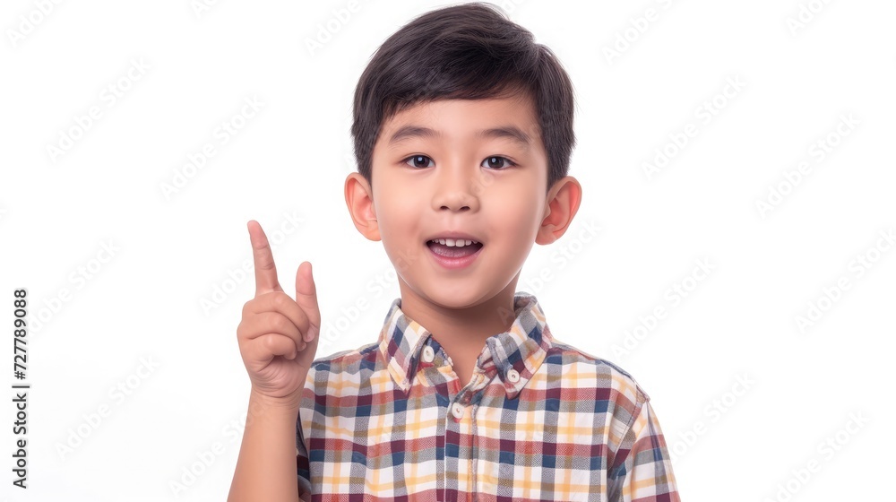 Cute Asian boy having a good idea isolated over a white background Cute Asian boy having a good idea isolated over a white background