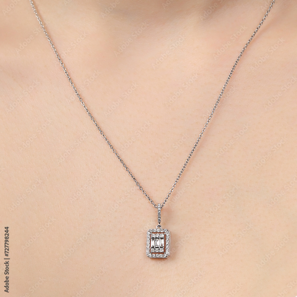 Diamond necklace around the neck of the model in a white blouse. Diamond necklace around the neck of the model in a white blouse.
